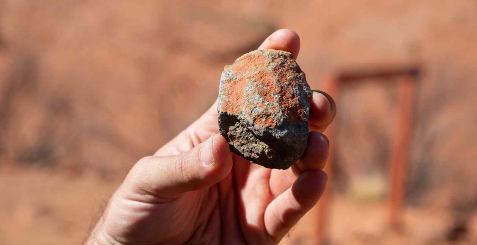 Person holding rock