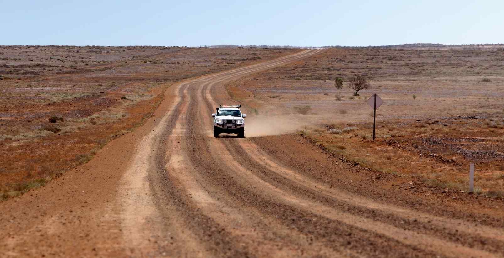 Car driving on dirst road