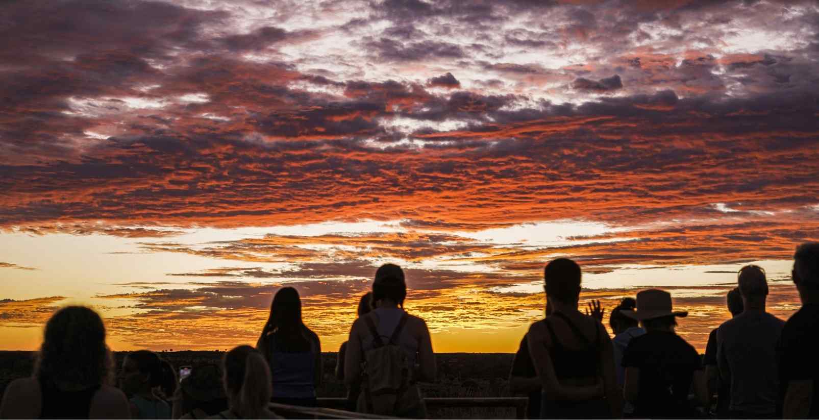 people watching sunset