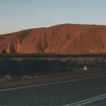 Car parked on road near Uluru