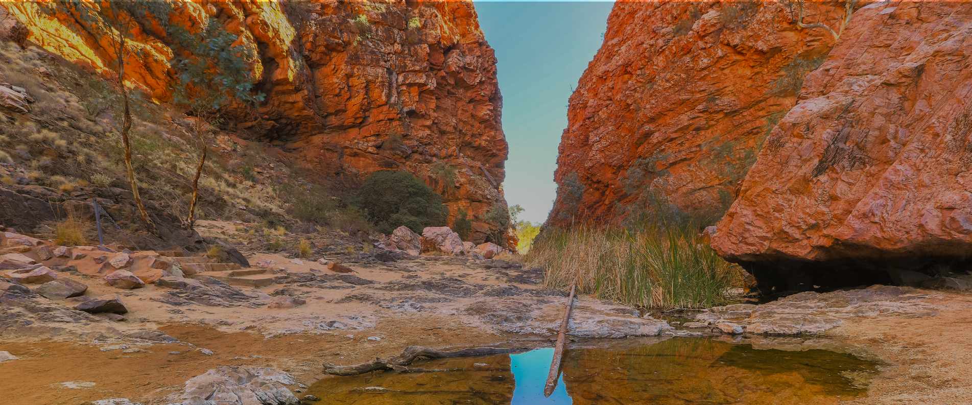 Waterhole between two cliffs in Alice Springs, Australia