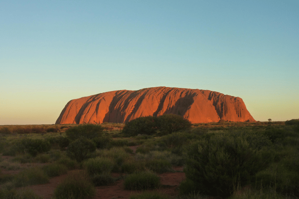 Uluru at sunset with evening sky